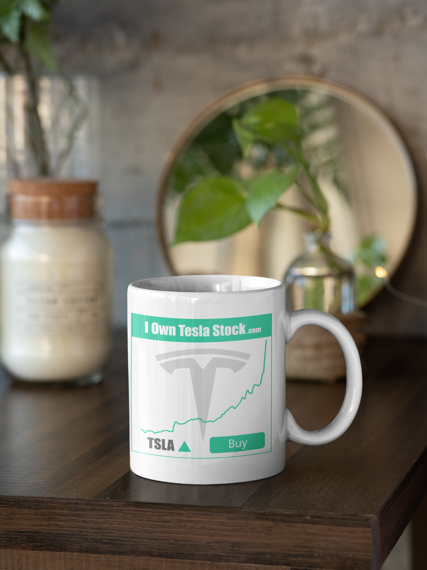 https://iownteslastock.com/cdn/shop/products/mockup-of-an-11-oz-coffee-mug-next-to-some-home-decorations-31310_1440x.png?v=1589646671